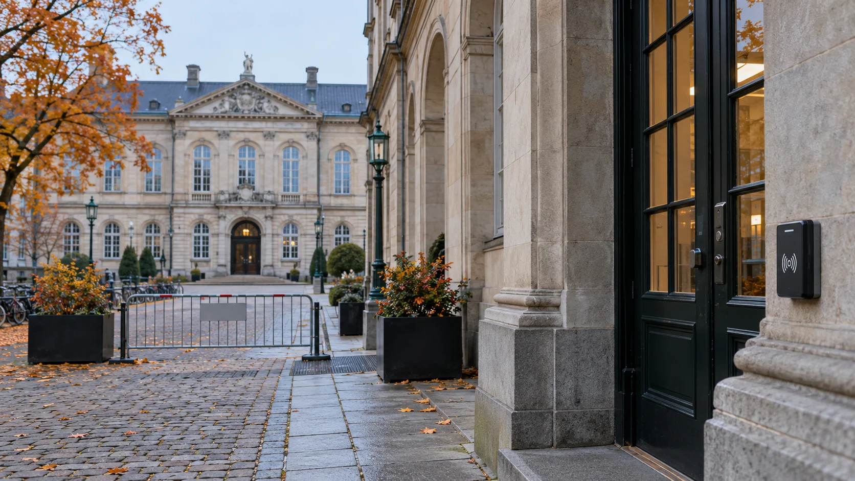 A Copenhagen campus entrance with a badge reader and a temporarily closed access point