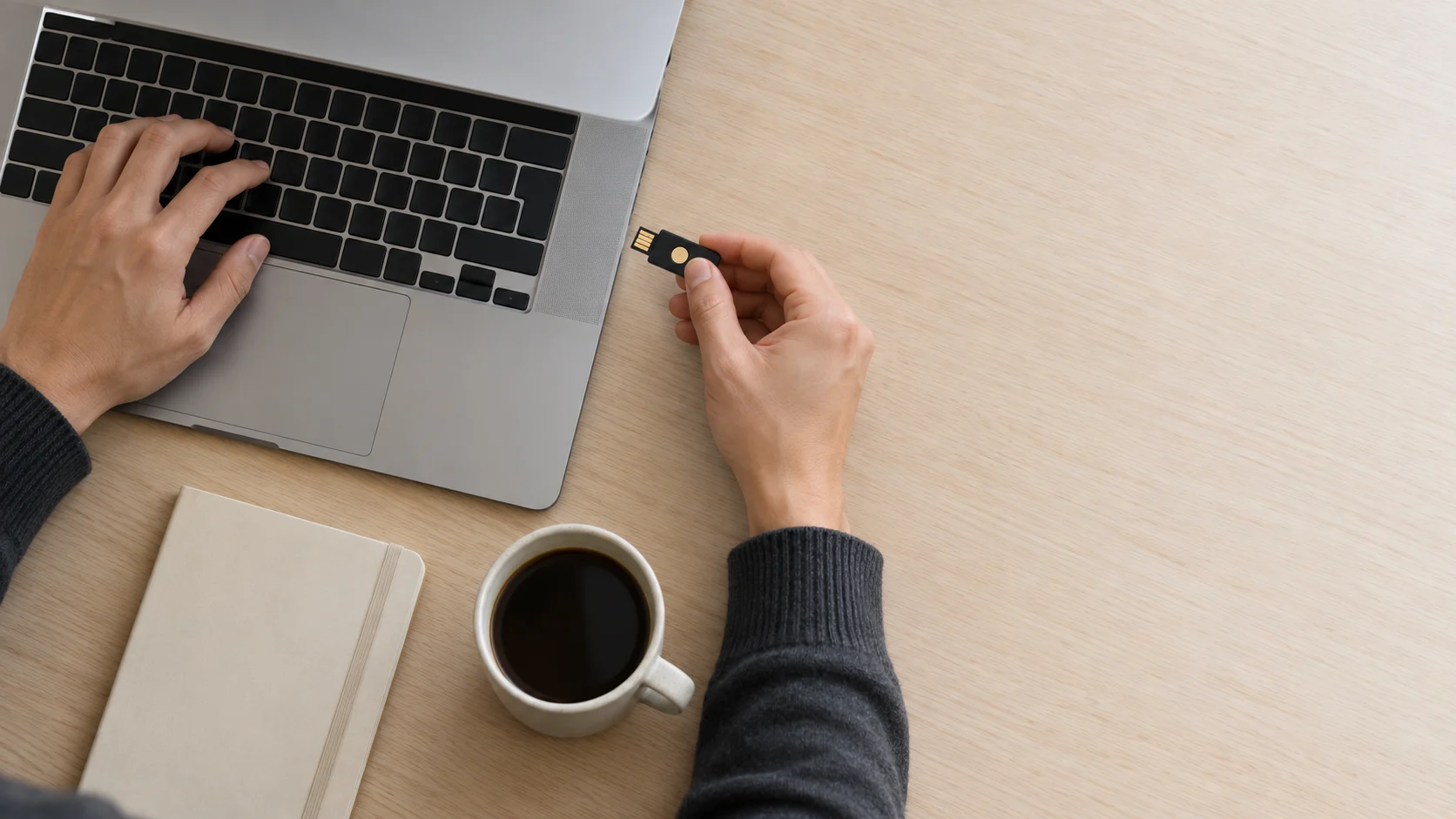 A developer replaces an access key beside a laptop